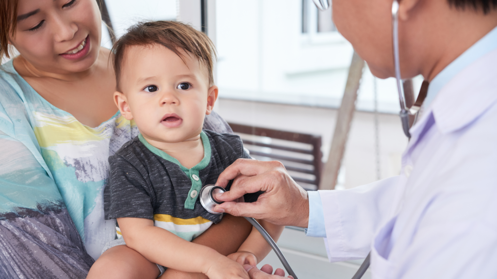 Pediatrician examining a young child during a check-up — highlighting the importance of early asthma and allergy diagnosis. Facts about asthma and allergies