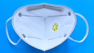 Medical face mask with valve, representing respiratory protection and testing standards