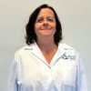 Dr. Angela Southey in lab coat at Airmid Healthgroup’s accredited virology and IAQ testing facility