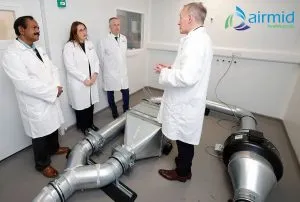 HVAC System Testing for Infectious Aerosols Team of scientists discussing HVAC aerosol exposure system at Airmid Healthgroup