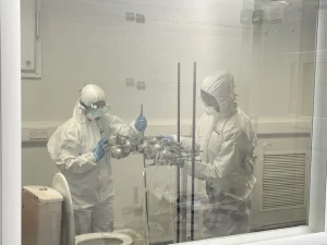 Scientists in full PPE conducting airborne mold growth testing in Airmid Healthgroup’s ISO and GLP-accredited virology lab
