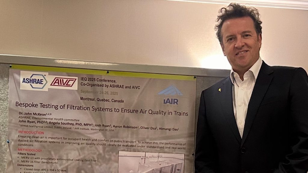 Alt Text: Dr. John McKeon presenting Airmid Healthgroup’s filtration science poster at IEQ 2025 in Montreal.