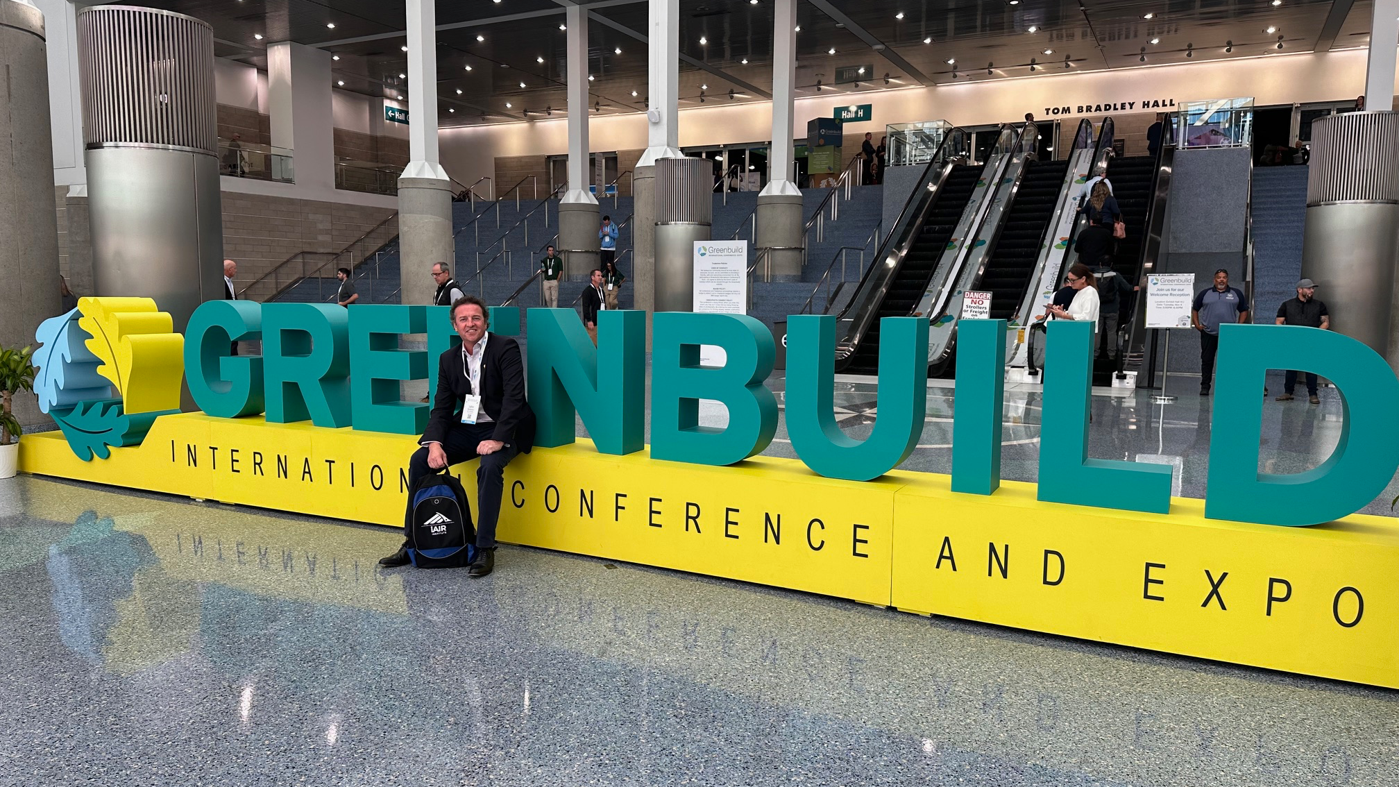 Dr. John McKeon of Airmid Healthgroup at Greenbuild 2025 in Los Angeles, attending discussions on material health, product transparency, and scientific validation in sustainable design, validate material health claims