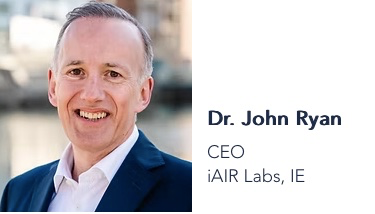 Dr. John Ryan at WFI 2025 – Airmid Healthgroup | Airmid Healthgroup Portrait of Dr. John Ryan, CEO of Airmid Healthgroup and iAIR Labs, speaking at WFI 2025 on AI-driven aerobiology and smart filtration innovation.