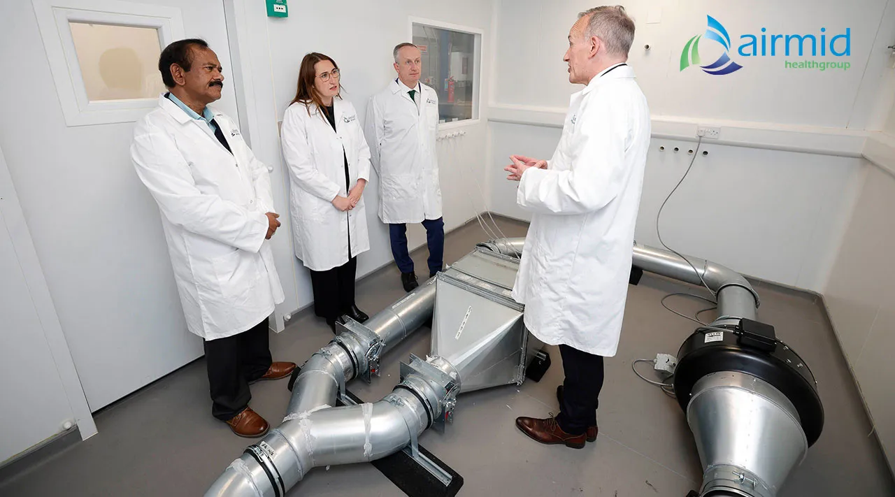 Scientist in an Airmid Healthgroup aerobiology test chamber during health claims verification testing