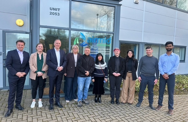 ASHRAE President Bill McQuade and ASHRAE Vice President Mahroo Eftekhari stand with the Airmid Healthgroup team outside the Dublin aerobiology and indoor environmental quality research facility.
