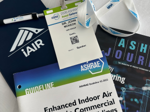 ASHRAE 2026 conference materials, including ASHRAE Guideline 42-2023, the ASHRAE Journal and Dr John McKeon's speaker badge