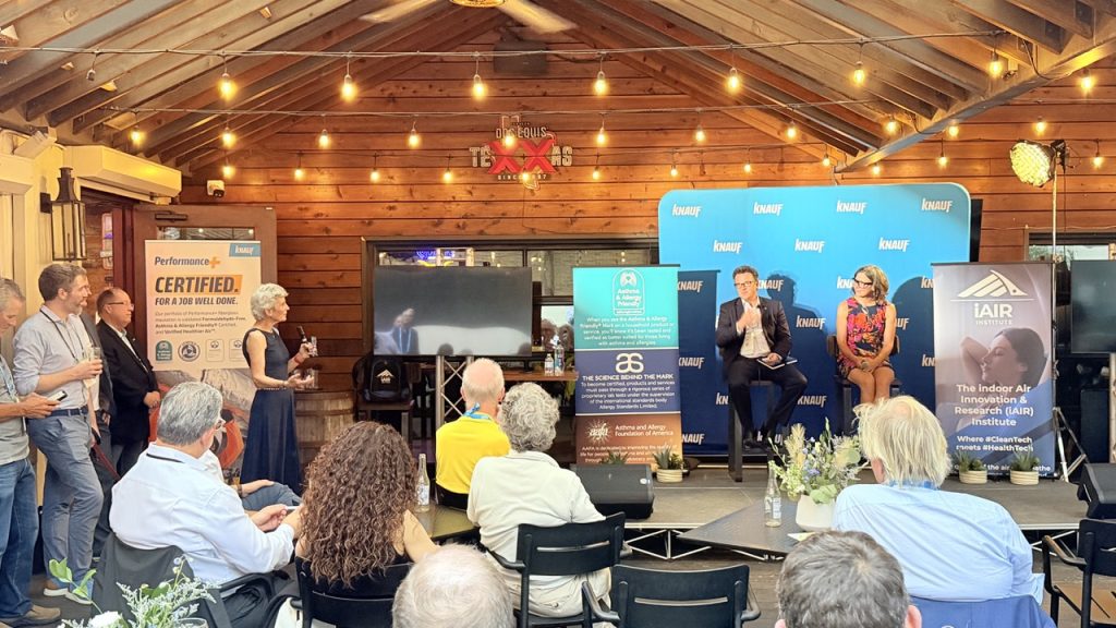 Dr Stephanie Wade asking a question at the iAIR Institute Scientific Leadership Forum, Cedar Door, Austin, during the 2026 ASHRAE Annual Conference, with Dr John McKeon and Dr Jessica Green on stage discussing healthy buildings