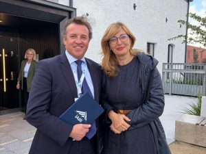 Dr John McKeon, holding an iAIR notebook, with European Commissioner Ekaterina Zaharieva at Trinity Innovation Hub, Dublin